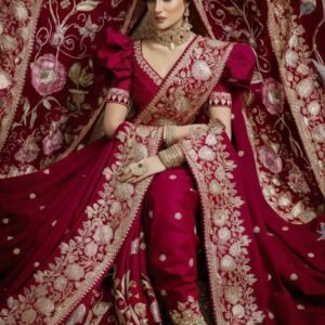 Drape yourself in timeless beauty with this exquisite bridal ensemble — a masterpiece of intricate golden embroidery on deep crimson silk. Each delicate thread tells a story of love, grace, and heritage. Designed for the bride who embodies both strength and softness, this regal attire transforms every moment into a memory of pure elegance. From the grand ceremony to the final vows, let your look shine as bright as your forever. ❤️👰‍♀️